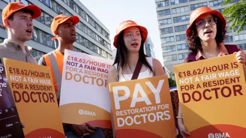 Striking resident doctors with the BMA British Medical Association union, stage their first day of industrial action outside St Thomas' Hospital on 25th July 2025, in London.