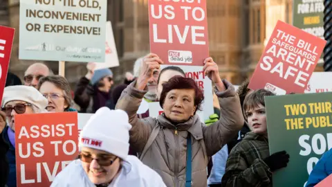 Getty Images Campaigners gather outside Houses of Parliament to demonstrate their opposition to Kim Leadbeater MP's Terminally Ill Adults (End of Life) Bill in the House of Commons in November 2024.