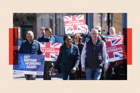 PA Wire Conservative Party leader Kemi Badenoch on the high street during a visit to Highworth in Swindon