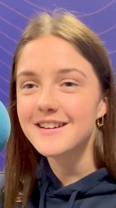 Jo Tuckett smiling to the left.