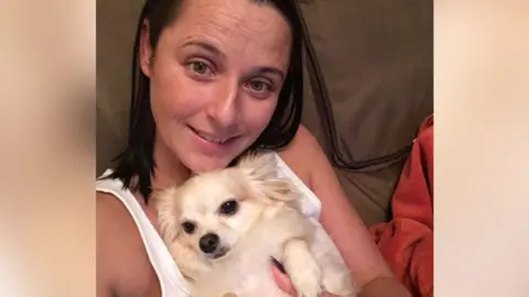 Nichola Gooch Nichola Gooch holding Chihuahua Frankie