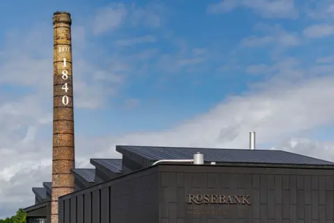 Lee Mawdsley Rosebank Distillery - a big chimney that says established 1840 on it