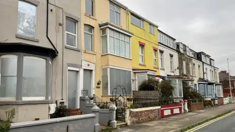 Street view of decommissioned terraced houses on Charles Street, Blackpool