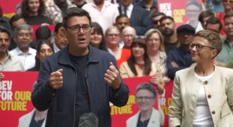 Bev Craig with Andy Burnham as they talk to a Labour crowd