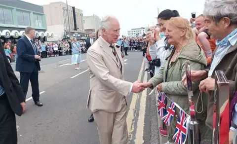 Lancaster City Council King Charles shaking hands with crowds of well wishes in during his visit to Morecambe in 2022 when he was the Prince of Wales.