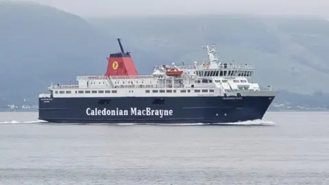 Christopher Brindle A achromatic  and achromatic  ship, Caledonian Isles, seen sideways on, sailing with hills successful  the background