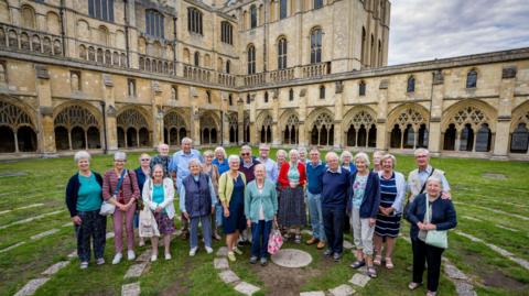 Members of Norwich Cathedral Friends in front of the cathedral