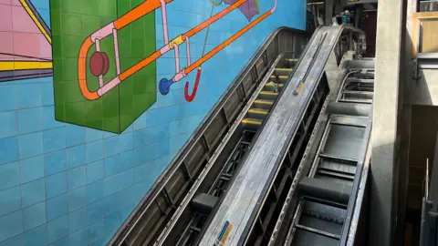 Kumail Jaffer/LDRS Broken escalator with missing steps