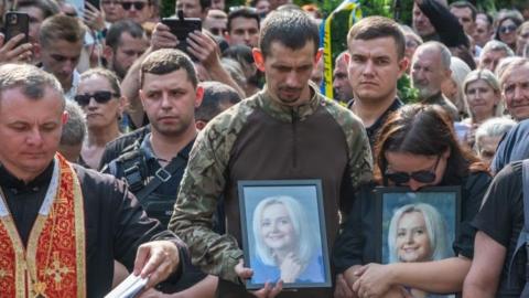 Hundreds of people attend the funeral of political and social activist, linguist Iryna Farion at the Garrison Church of the Holy Apostles Peter and Paul in Lviv, Ukraine, on July 22, 2024