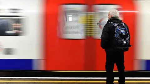 man waiting for train