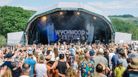 A crowd gathered around a stage at Wychwood Festival