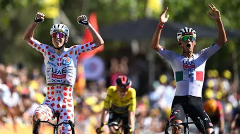 Isaac del Toro (right) & Tadej Pogacar left celebrate