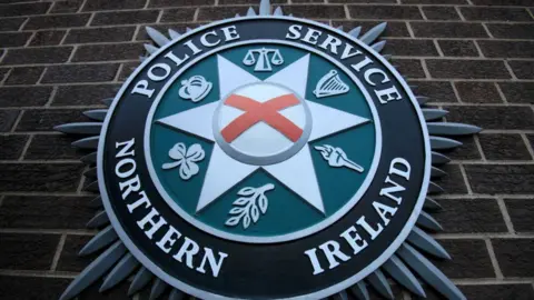 A coat of arms is pictured at the Police Service of Northern Ireland (PSNI) Headquarters in Belfast, Northern Ireland, on February 5, 2010