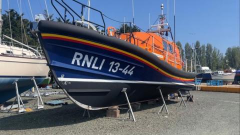 RNLI lifeboat on hard standing at a marina