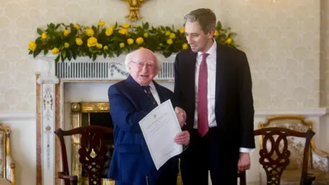  EPA-EFE/REX/Shutterstock President Michael Higgins shakes hands with newly elected Taoiseach Simon Harris