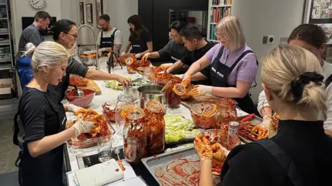 Judy Joo Korean-American TV chef Judy Joo teaching how to make kimchi from scratch in her central London flat. Joo and her