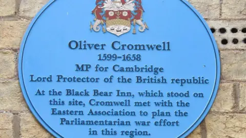 Geograph/Colin Smith Blue plaque on Market Passage in Cambridge, commemorating Oliver Cromwell's Civil War appearance at the Black Bear Inn on this site.
