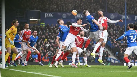 Arsenal look to score from a corner against Portsmouth in their FA Cup match at Fratton Park