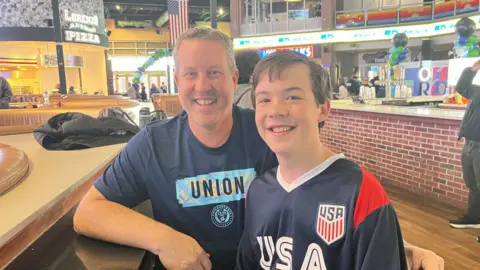 BBC Image shows USA supporters Jim House and his son Maxwell