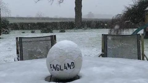 Mikesnapper A football on a snowy garden table