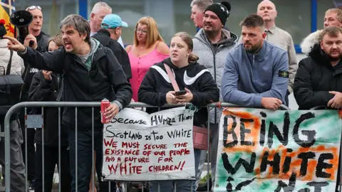 Getty Images Anti-migrant protesters demonstrate outside the Cladhan Hotel in Falkirk on 7 September.