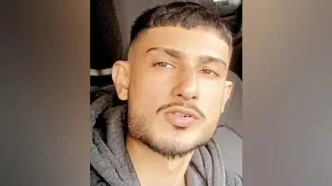 Family Selfie of Aurman Singh sitting in a vehicle in a grey hoodie