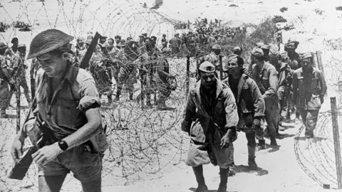 Getty Images Italian prisoners being marched across the desert after the Battle of El Alamein. 