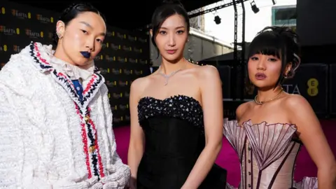 Getty Images Audrey Nuna, EJAE and Rei Ami attend the EE BAFTA Film Awards 2026 at The Royal Festival Hall on February 22, 2026 in London, England