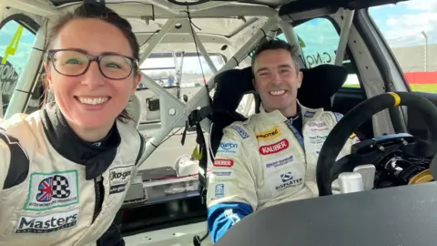 Claire Norman A selfie of Claire and her father inside the BMW