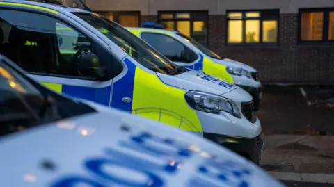 Three police vans in a row