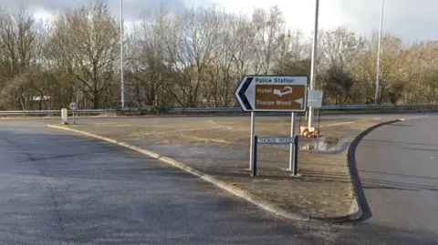 Google Thorpe Wood roundabout road sign 