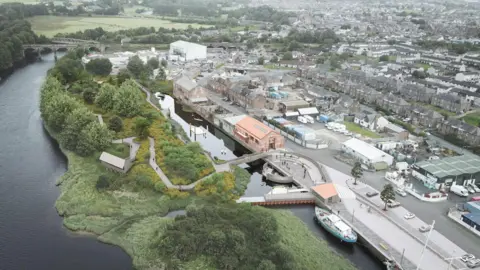 An aerial view of Annan harbour showing landscaped walkways bordering the river and separating waterways with a bridge and small dam, as well as a number of buildings 