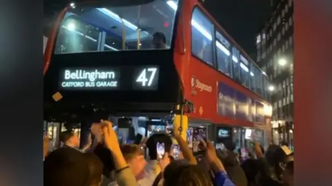 England fans singing and dancing after spotting 'Bellingham' bus in London