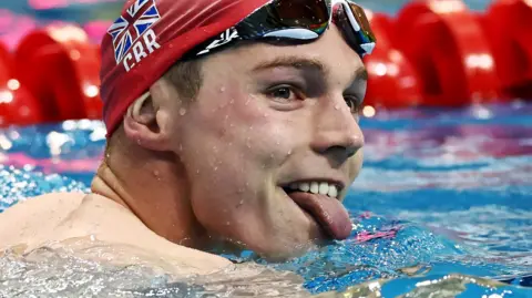 Duncan Scott celebrates victory in Singapore 