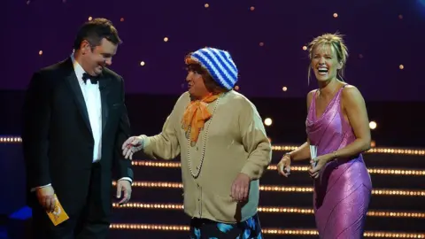 Pacemaker PACEMAKER BELFAST PHOTO WILLIAM CHERRY 5/9/02 EAMONN HOLMES AND CAROL SMILLIE, PRESENTERS OF BBC NORTHERN IRELAND'S MAKING A DIFFERENCE, WHICH WAS RECORDED LAST NIGHT IN BELFAST'S GRAND OPERA HOUSE, WELCOME ON STAGE ONE OF NORTHERN IRELAND'S MOST FAMOUR HOUSEWIVES MRS MAY MCFETRIDGE. THE PROGRAMME WILL BE SCREENED TONIGHT (FRIDAY) ON BBC ONE NORTHERN IRELAND AT 7.00PM. FOR MORE INFORMATION CONTACT: CAROLINE COOPER, BBC NI PRESS OFFICE, 0780 103 6273.