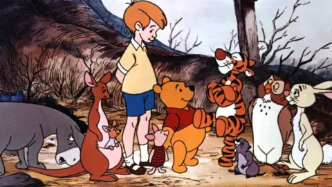 A cartoon image of a donkey, kangaroo and her joey, a blond boy, a piglet, bear, tiger, owl, rabbit and beaver.