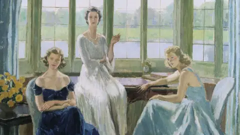 Trustees of the Leeds Castle Foundation A painted portrait of Lady Baillie and two other women shows three figures in formal dress positioned in a room with large windows overlooking greenery. One figure is seated in a dark outfit on the left, another stands in a light-coloured gown at the centre holding an object, and a third leans on a table to the right, with soft natural light filling the interior.