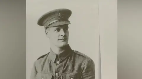 Supplied A black and white posed image of Frank Porter in a military uniform. He is looking to his left and slightly smiling.