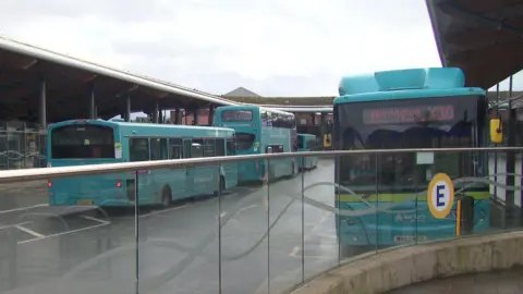 Buses standing at Chester bus station. The Warrington X30 is at the front.