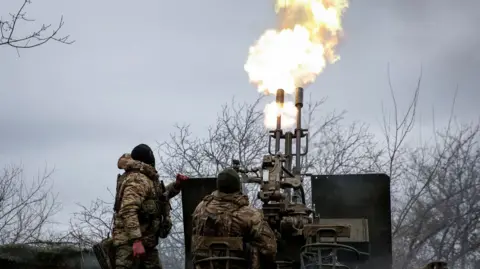 Ukrainian servicemen from air defence unit of the 93rd Mechanized Brigade fire an anti aircraft cannon at a frontline in Ukraine