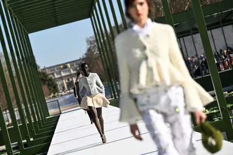 JULIEN DE ROSA/AFP Models presents creations for Christian Dior for the Women's Ready to Wear Fall/Winter 2026-2027 collection fashion show as part of the Paris Women Fashion Week, in Paris, on March 3, 2026. 