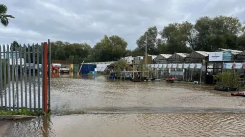 Businesses based at the site of the Maulden Garden Centre under about 2ft of water following the recent flooding.