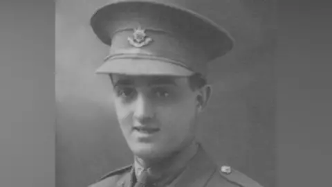Family Handout A black-and-white image of a WW1 soldier in uniform