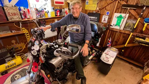 Martin Giles/BBC Andrew Downes on the trike he built