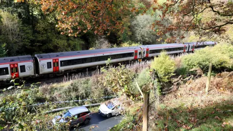 PA Emergency workers at the scene after a collision involving two trains near Llanbrynmair, mid Wales