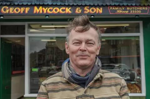 Simon Buckley Andy Mycock outside Geoff Mycock & Son butchers in Buxton