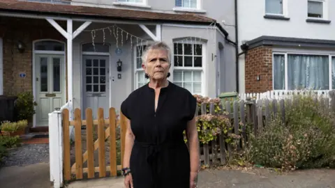 LDRS Ruth Dickie standing outside her home next to David Bowie's former house