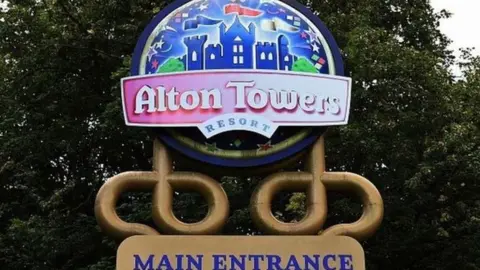 The sign for Alton Towers with another sign underneath saying "Main Entrance".
