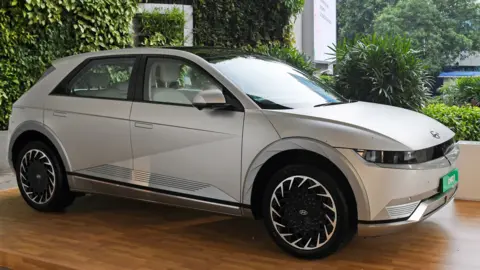 A silver coloured Hyundai electric car kept on display at the National Stock Exchange (NSE) in Mumbai