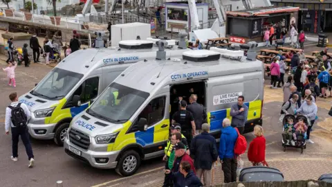 Essex Police vans pictured using live facial recognition technology in Clacton during the airshow